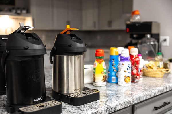 Coffee machines, coffee creamers on counter